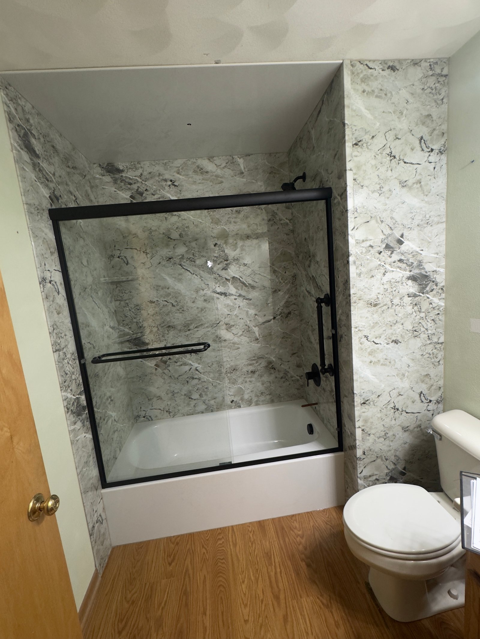 White subway tile bathtub and shower with brushed nickel fixtures in Wisconsin